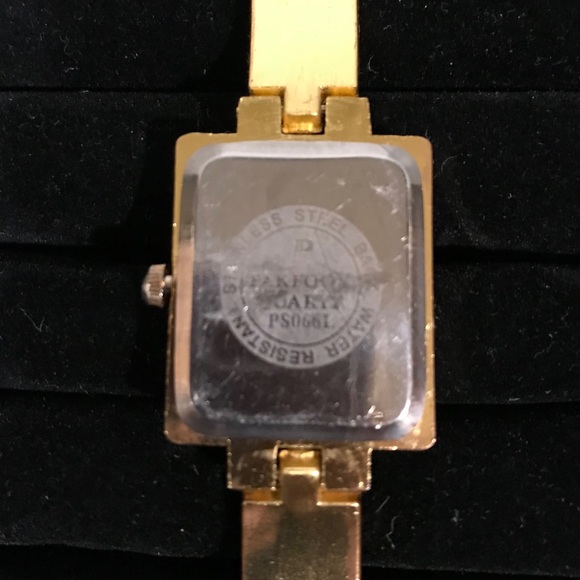 Pak Fook Goldstone watch w/floral-crystal accents. - Picture 7 of 8